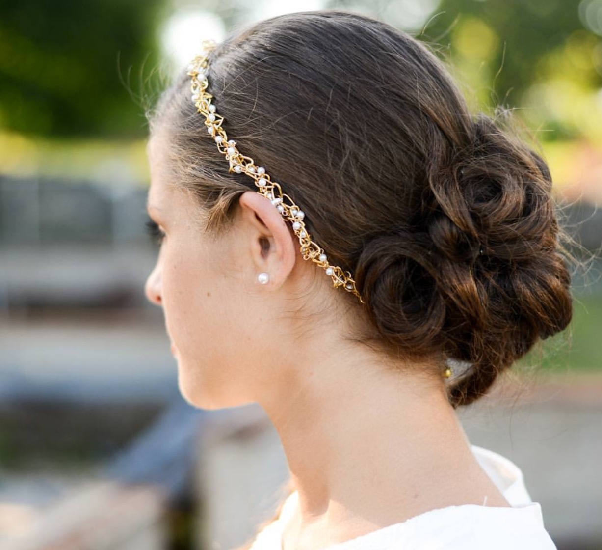 Wedding Hairstyles You'll Love. Classic Low Chignon. Mint Photography. Elegant, Vintage-Style Curls. Tim Waters Photograph. Romantic Updo With a Crown of Roses.